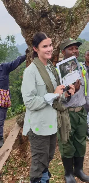 A guest celebrating a memorable forest experience